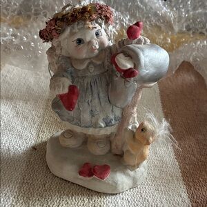 Adorable Child Figurine with Red and Silver Details